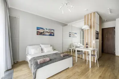 Łóżko lub łóżka w pokoju w obiekcie Klimatyzowane Apartamenty Studio Mennica Residence