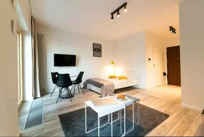 Telewizja i/lub zestaw kina domowego w obiekcie Apartamenty Studio Mennica Residence