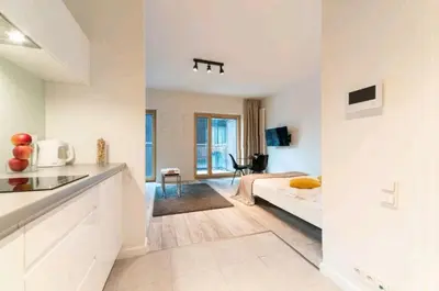 Telewizja i/lub zestaw kina domowego w obiekcie Apartamenty Studio Mennica Residence