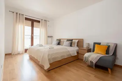 Łóżko lub łóżka w pokoju w obiekcie Norblin City View Apartment