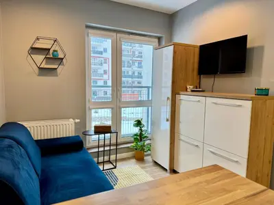Telewizja i/lub zestaw kina domowego w obiekcie Cozy Nest Ogrody Włochy