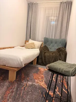 Łóżko lub łóżka w pokoju w obiekcie Sloth Room