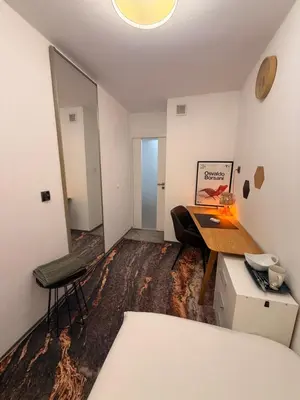Łóżko lub łóżka w pokoju w obiekcie Sloth Room