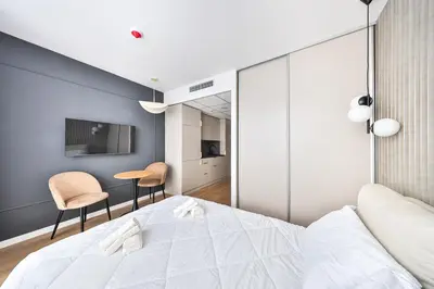 Łóżko lub łóżka w pokoju w obiekcie I PerfectApart I Pileckiego 59 I Parking I 419 & 417