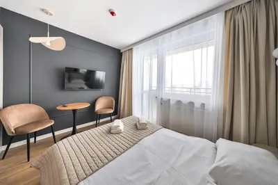 Łóżko lub łóżka w pokoju w obiekcie I PerfectApart I Pileckiego 59 I Parking I 419 & 417