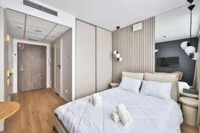 Łóżko lub łóżka w pokoju w obiekcie I PerfectApart I Pileckiego 59 I Parking I 419 & 417
