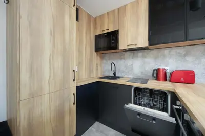 Kuchnia lub aneks kuchenny w obiekcie Modern One-Bedroom Apartment in the City Centre 550 m to the Palace of Culture and Science by Noclegi Renters