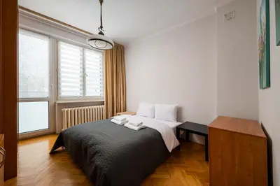 Łóżko lub łóżka w pokoju w obiekcie Warsaw Old Town Comfort Apartment by BookingHost