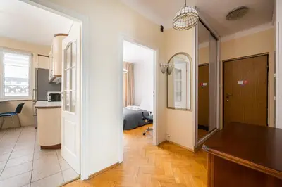Łóżko lub łóżka w pokoju w obiekcie Warsaw Old Town Comfort Apartment by BookingHost