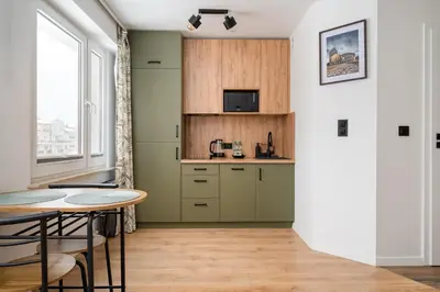 Kuchnia lub aneks kuchenny w obiekcie Wawer Urban Jungle Studio by BookingHost