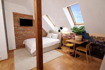Łóżko lub łóżka w pokoju w obiekcie Castle apartment Piwna