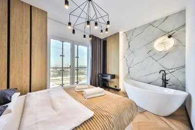 Łóżko lub łóżka w pokoju w obiekcie Kasprzaka 29 Wola Tower Apt z Wanną i Widokiem Na Panoramę Centrum By Perfect Apart 1231