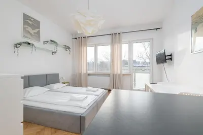 Łóżko lub łóżka w pokoju w obiekcie RentPlanet - Studio Hoża