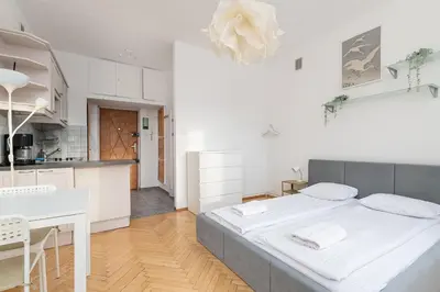 Łóżko lub łóżka w pokoju w obiekcie RentPlanet - Studio Hoża