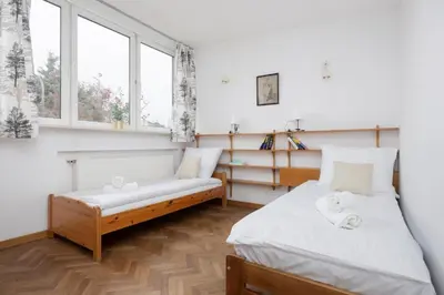 Łóżko lub łóżka w pokoju w obiekcie Rzymska Warsaw House Apartment by Solarento