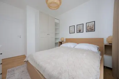 Łóżko lub łóżka w pokoju w obiekcie Gocław Harmony Apartments Znanieckiego by Solarento