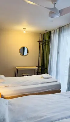 Łóżko lub łóżka w pokoju w obiekcie Warsaw City Haven Private Rooms