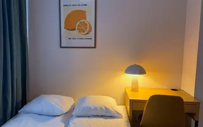 Łóżko lub łóżka w pokoju w obiekcie Warsaw City Haven Private Rooms