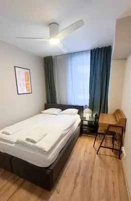 Łóżko lub łóżka w pokoju w obiekcie Warsaw City Haven Private Rooms
