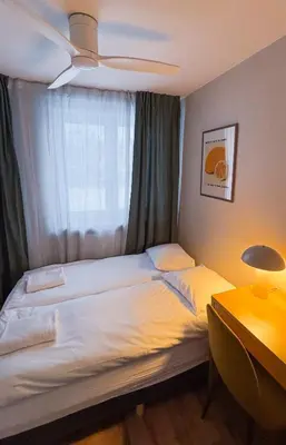 Łóżko lub łóżka w pokoju w obiekcie Warsaw City Haven Private Rooms
