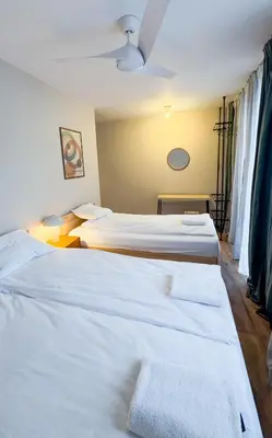 Łóżko lub łóżka w pokoju w obiekcie Warsaw City Haven Private Rooms