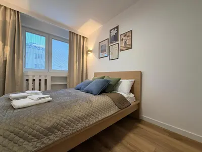 Łóżko lub łóżka w pokoju w obiekcie Modern Comfort Apartment by OhMyHome Zgoda 9