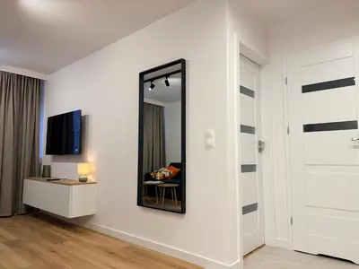 Telewizja i/lub zestaw kina domowego w obiekcie Modern Comfort Apartment by OhMyHome Zgoda 9