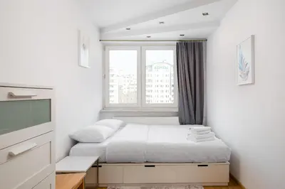 Łóżko lub łóżka w pokoju w obiekcie Warszawa Wola Center 3-Bedroom Apartment by BookingHost