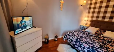 Telewizja i/lub zestaw kina domowego w obiekcie HomeComfort Apartament Boho