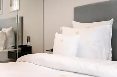Łóżko lub łóżka w pokoju w obiekcie MENNICA RESIDENCE PRESTIGE Apartments