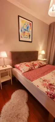 Łóżko lub łóżka w pokoju w obiekcie HomeComfort Apartament Wenecja