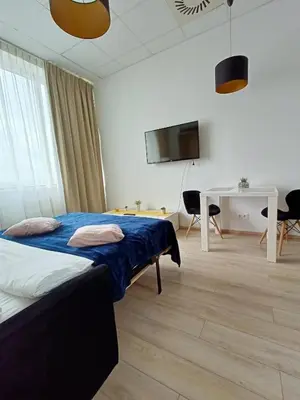 Łóżko lub łóżka w pokoju w obiekcie Zlatarooms 122