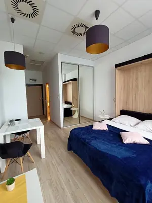 Łóżko lub łóżka w pokoju w obiekcie Zlatarooms 122