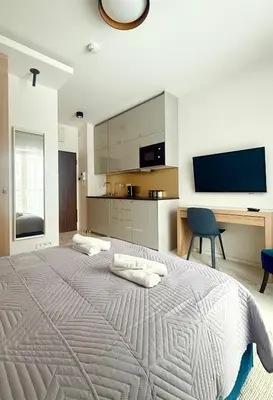 Łóżko lub łóżka w pokoju w obiekcie Cozy Stay Pawia Studio