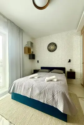 Łóżko lub łóżka w pokoju w obiekcie Cozy Stay Pawia Studio