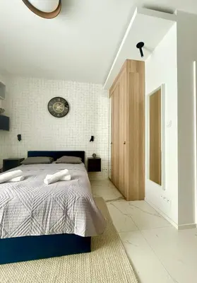 Łóżko lub łóżka w pokoju w obiekcie Cozy Stay Pawia Studio