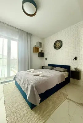 Łóżko lub łóżka w pokoju w obiekcie Cozy Stay Pawia Studio