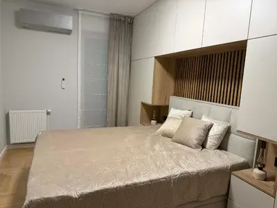 Łóżko lub łóżka w pokoju w obiekcie Blue Apartment Na Okrzei