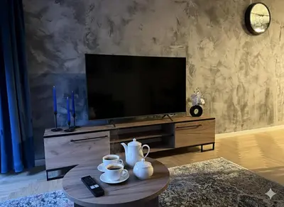 Telewizja i/lub zestaw kina domowego w obiekcie Blue Apartment Na Okrzei