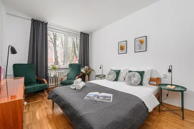 Łóżko lub łóżka w pokoju w obiekcie Lumina cozy 3-room apartment in Warsaw