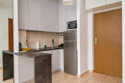 Kuchnia lub aneks kuchenny w obiekcie Piaskowa Comfort Apartment by BookingHost