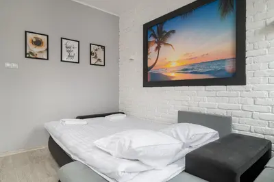 Łóżko lub łóżka w pokoju w obiekcie Piaskowa Comfort Apartment by BookingHost