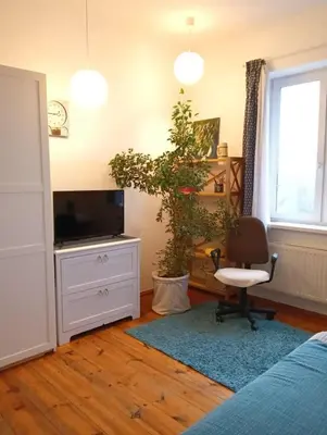 Telewizja i/lub zestaw kina domowego w obiekcie Cozy apartment in Warsaw's Praga Północ