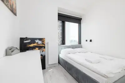 Łóżko lub łóżka w pokoju w obiekcie Towarowa Towers - 12 piętro - piękny widok - 2 pokoje