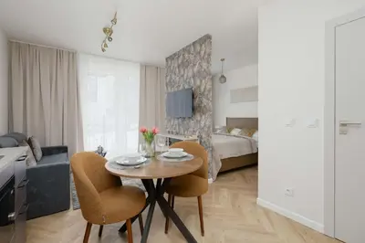 Łóżko lub łóżka w pokoju w obiekcie Unique Studio for 4 Guests with Underground Parking by Noclegi Renters