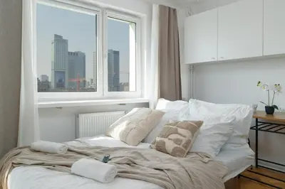 Łóżko lub łóżka w pokoju w obiekcie LYNA Home Gold - Manhattan View