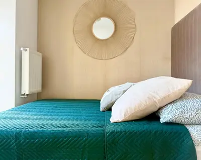 Łóżko lub łóżka w pokoju w obiekcie Cozy Stay Kępna Apartment