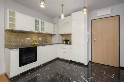 Kuchnia lub aneks kuchenny w obiekcie Atmospheric Apartment in Warsaw for 4 Guests by Noclegi Renters