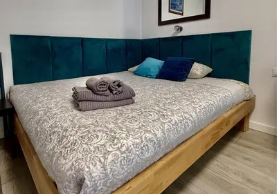 Łóżko lub łóżka w pokoju w obiekcie A&Y Apartments Airport Chopin Modzelewskiego