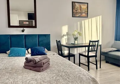 Łóżko lub łóżka w pokoju w obiekcie A&Y Apartments Airport Chopin Modzelewskiego